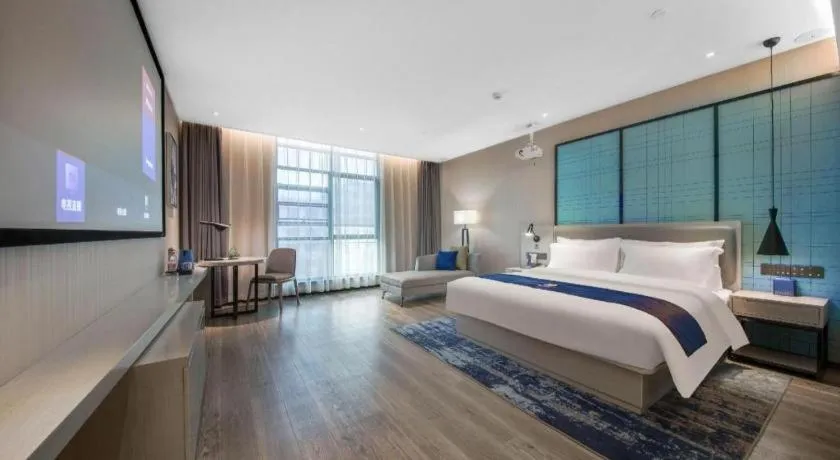 Bed in Echarm Hotel Xinyu Railway Station Baoshi Park