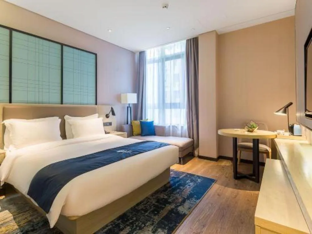 Bed in Echarm Hotel Nanjing Jiangning Tianyin Avenue Metro Station