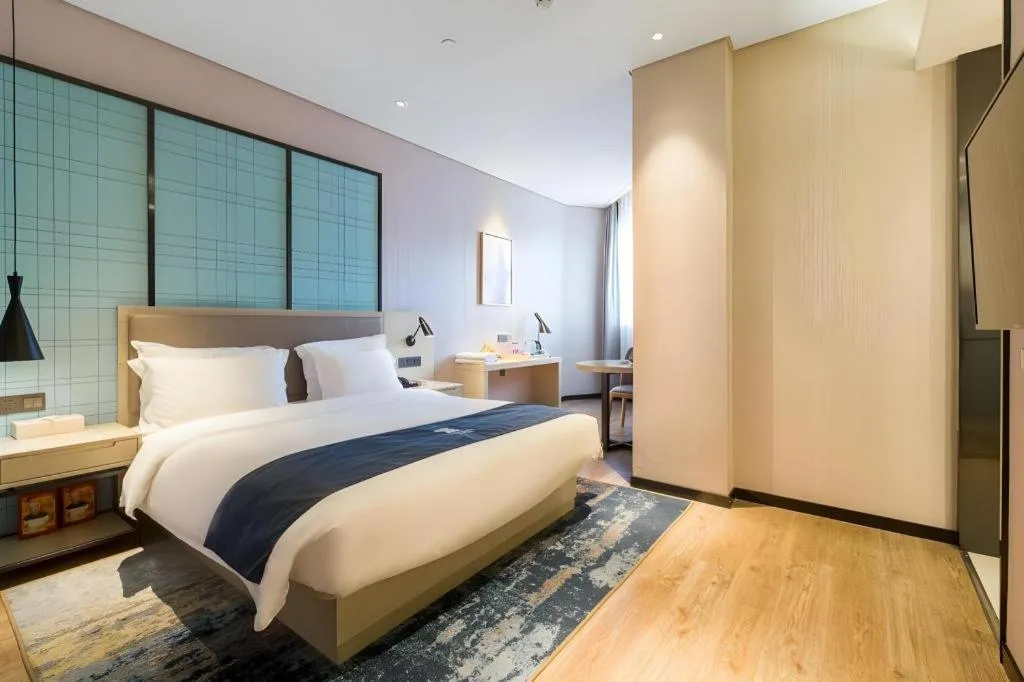 Bed in Echarm Hotel Nanjing Jiangning Tianyin Avenue Metro Station