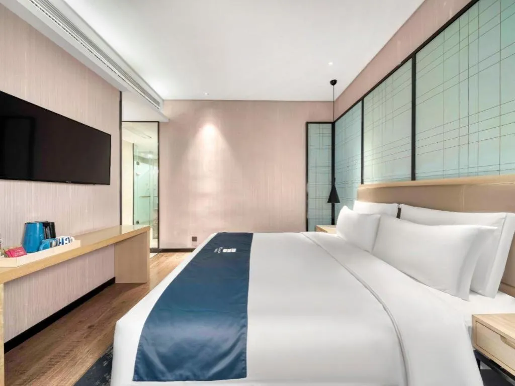 Bed in Echarm Hotel Nanjing Jiangning Tianyin Avenue Metro Station