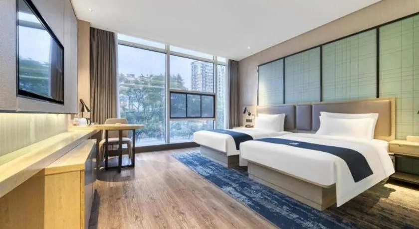 Bed in Echarm Hotel Nanjing Jiangning Tianyin Avenue Metro Station