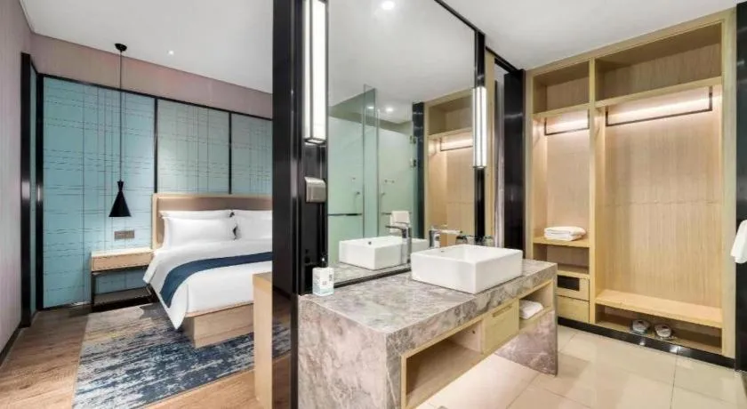 Bed in Echarm Hotel Nanjing Jiangning Tianyin Avenue Metro Station