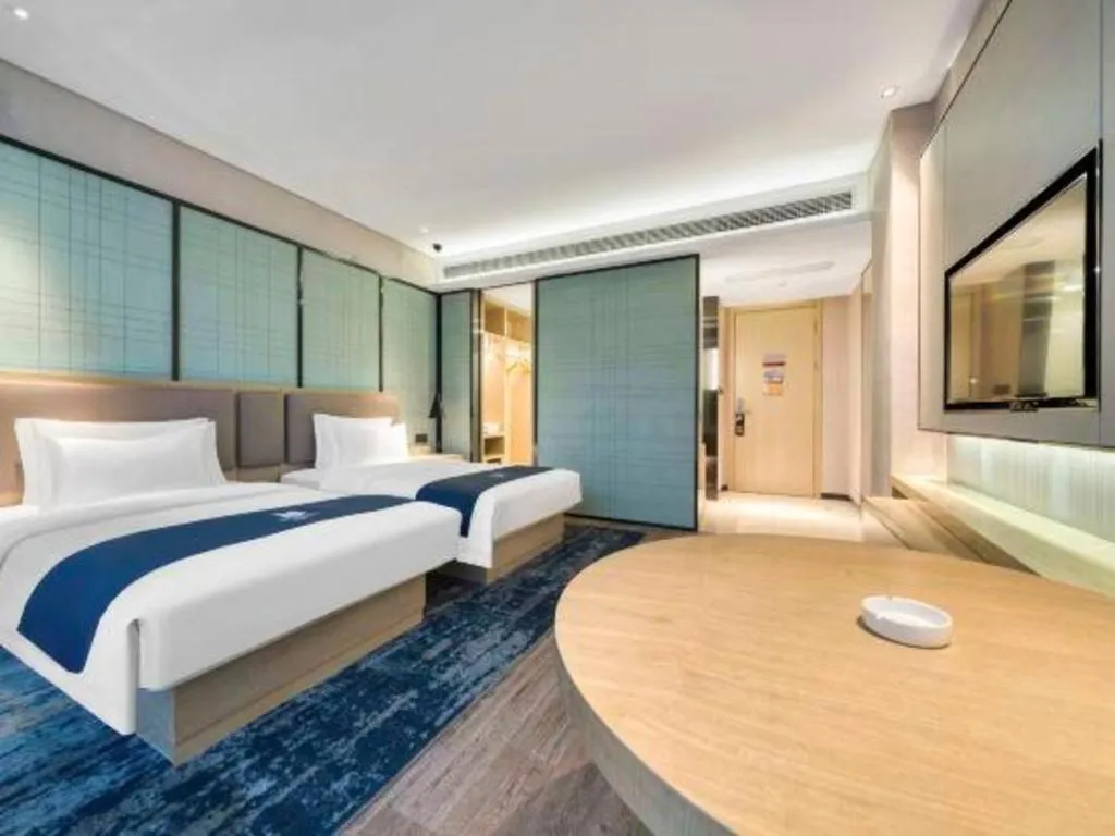 Bed in Echarm Hotel Nanjing Jiangning Tianyin Avenue Metro Station