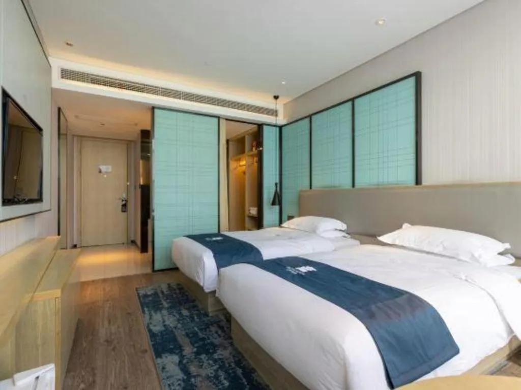 Bed in Echarm Hotel Nanjing Jiangning Tianyin Avenue Metro Station