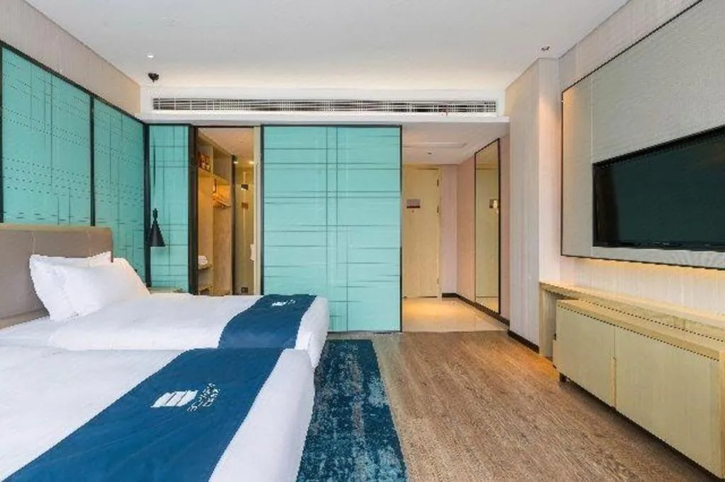 Bed in Echarm Hotel Nanjing Jiangning Tianyin Avenue Metro Station