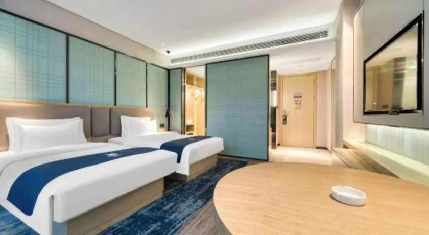 Bed in Echarm Hotel Nanjing Jiangning Tianyin Avenue Metro Station