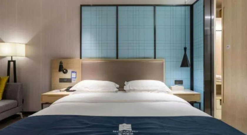 Bed in Echarm Hotel Nanjing Jiangning Tianyin Avenue Metro Station