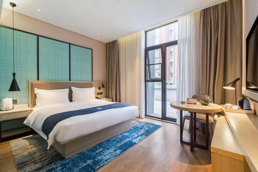 Bed in Echarm Hotel Nanjing Jiangning Tianyin Avenue Metro Station