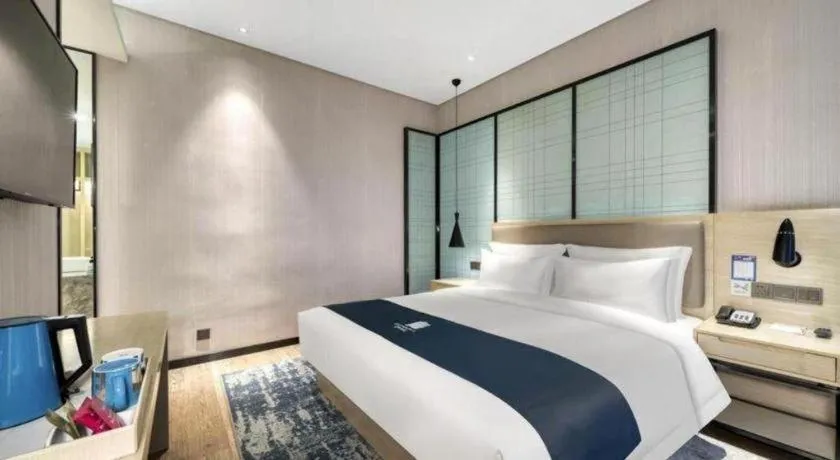 Bed in Echarm Hotel Nanjing Jiangning Tianyin Avenue Metro Station