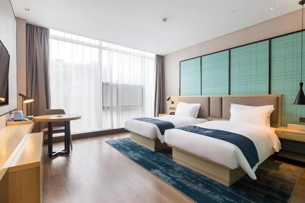 Bed in Echarm Hotel Nanjing Jiangning Tianyin Avenue Metro Station