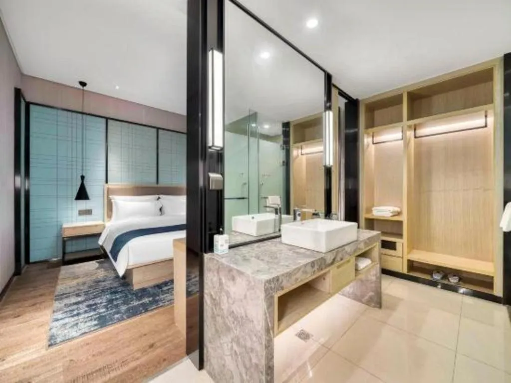 Bed in Echarm Hotel Nanjing Jiangning Tianyin Avenue Metro Station