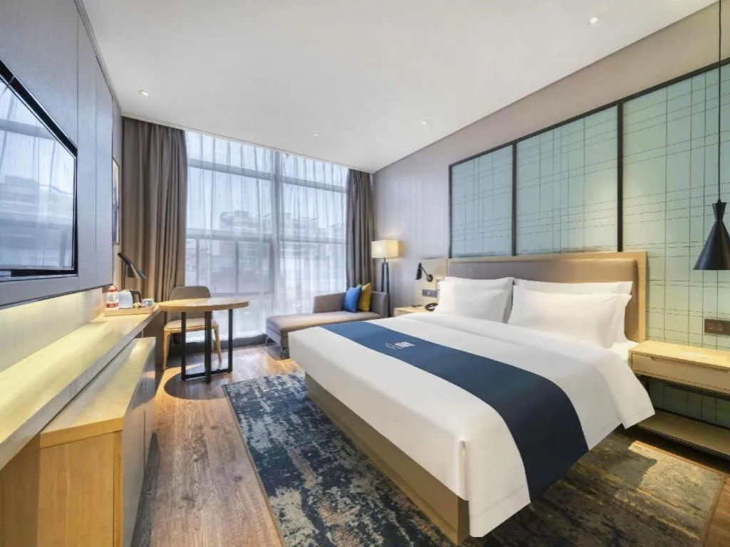 Bed in Echarm Hotel Nanjing Jiangning Tianyin Avenue Metro Station