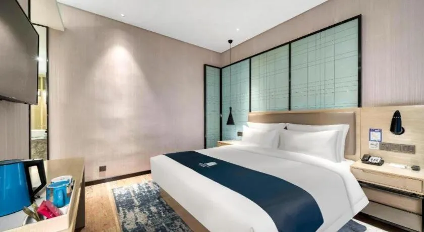 Bed in Echarm Hotel Nanjing Jiangning Tianyin Avenue Metro Station