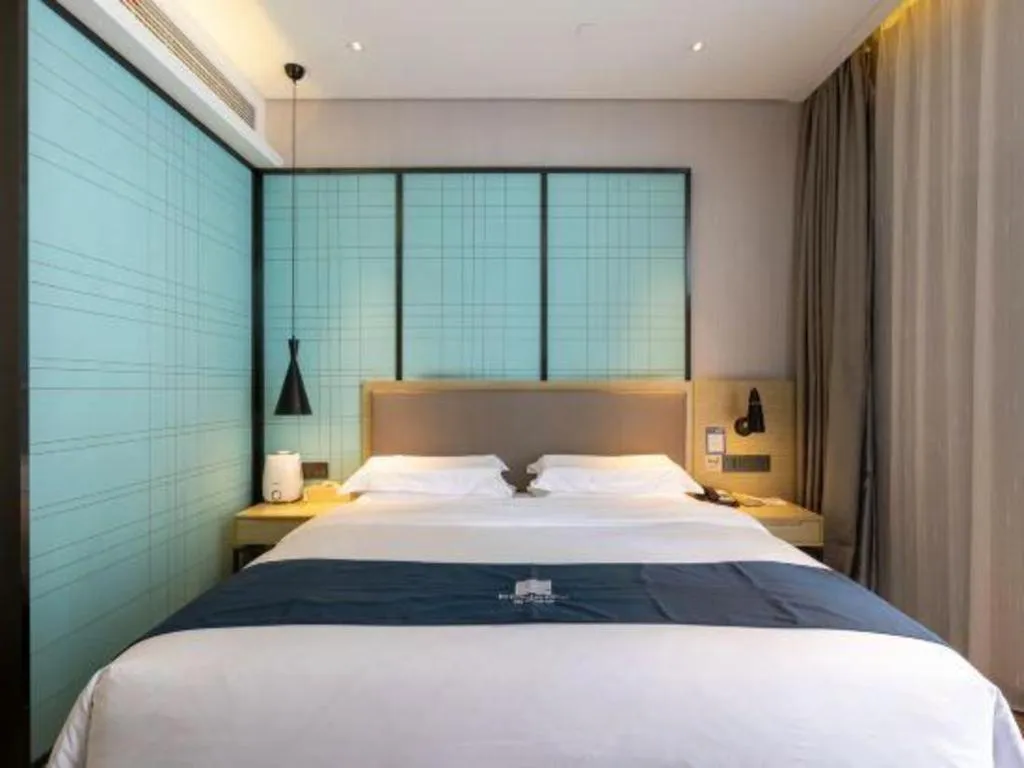 Bed in Echarm Hotel Nanjing Jiangning Tianyin Avenue Metro Station