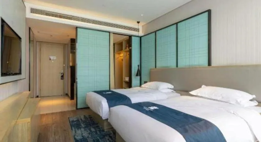 Bed in Echarm Hotel Nanjing Jiangning Tianyin Avenue Metro Station