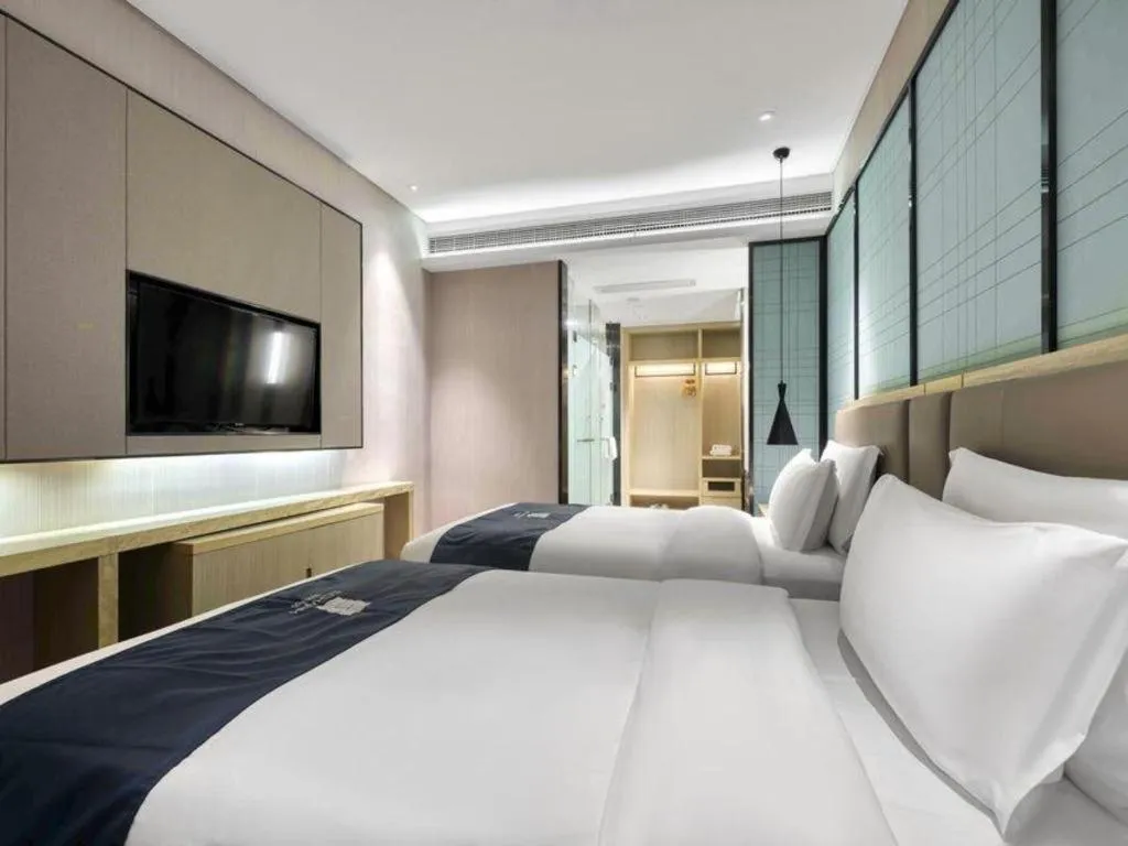 Bed in Echarm Hotel Nanjing Jiangning Tianyin Avenue Metro Station