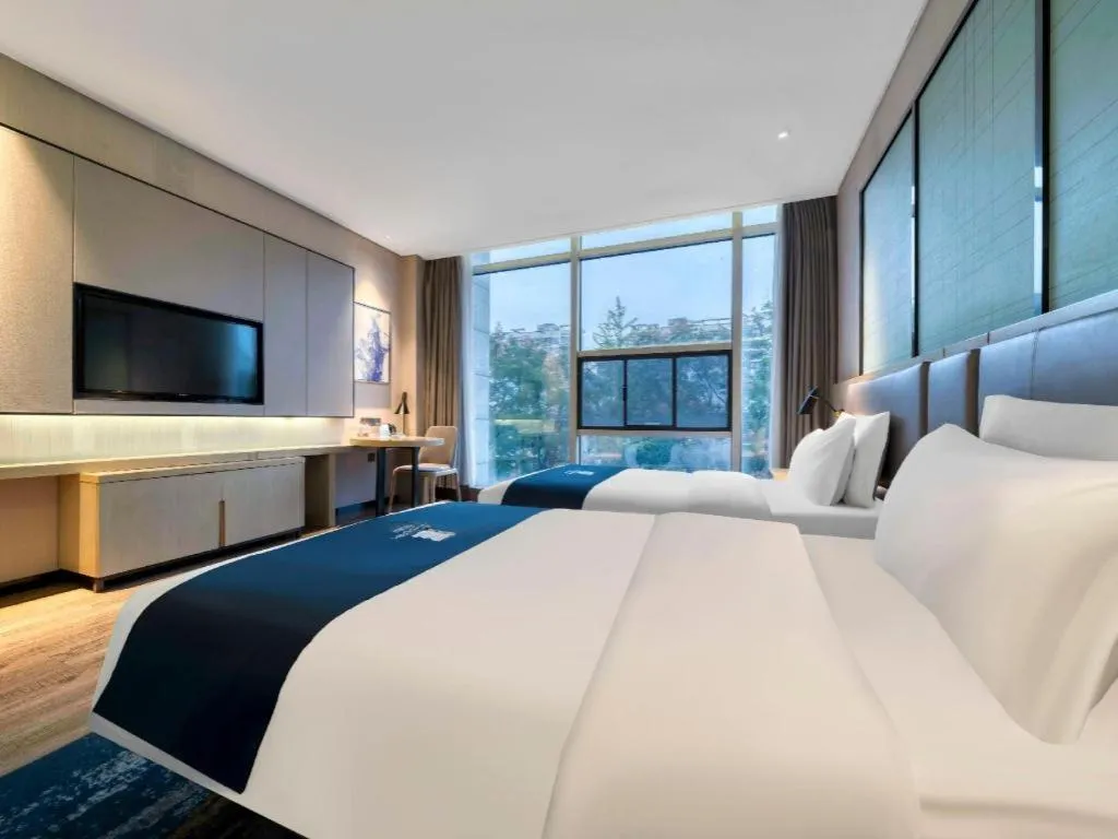 Bed in Echarm Hotel Nanjing Jiangning Tianyin Avenue Metro Station