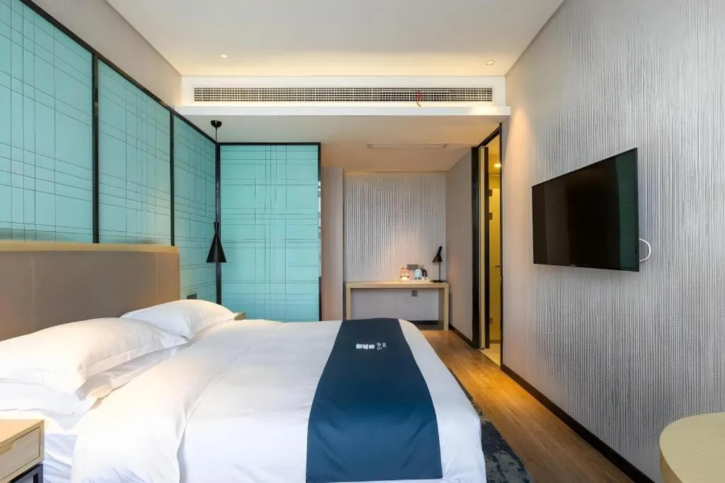 Bed in Echarm Hotel Nanjing Jiangning Tianyin Avenue Metro Station