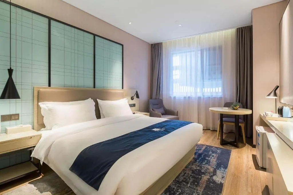 Bed in Echarm Hotel Nanjing Jiangning Tianyin Avenue Metro Station