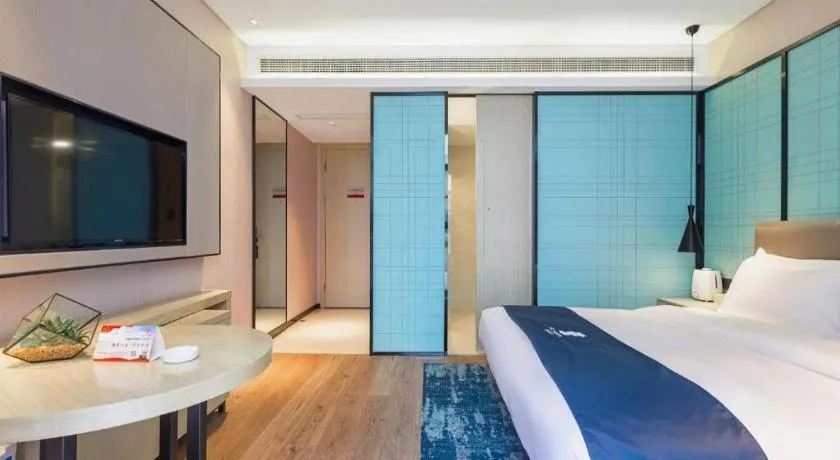 Bed in Echarm Hotel Nanjing Jiangning Tianyin Avenue Metro Station