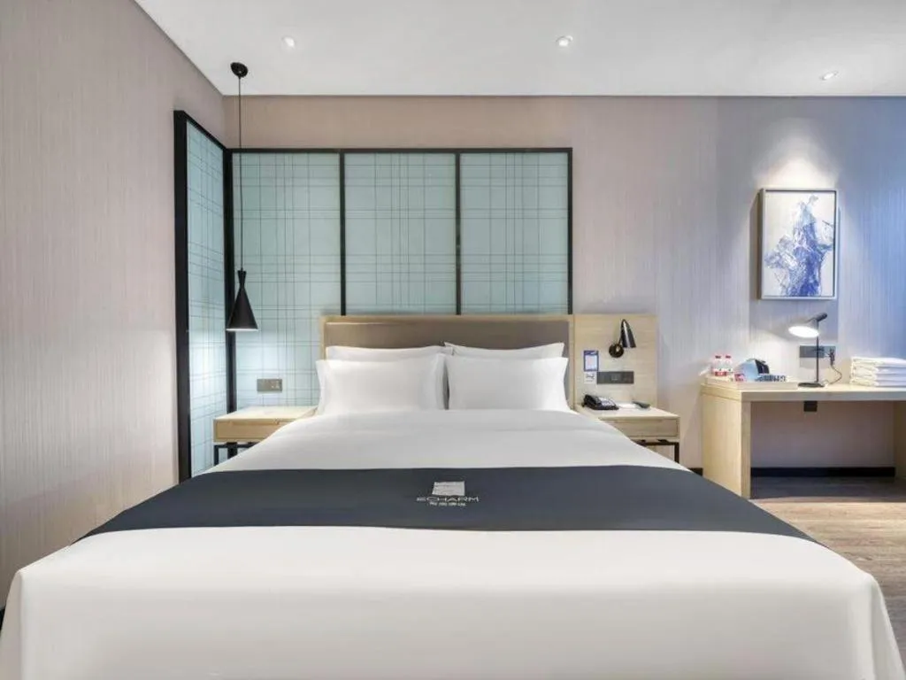 Bed in Echarm Hotel Nanjing Jiangning Tianyin Avenue Metro Station