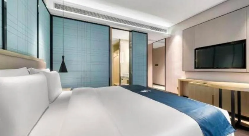 Bed in Echarm Hotel Nanjing Jiangning Tianyin Avenue Metro Station