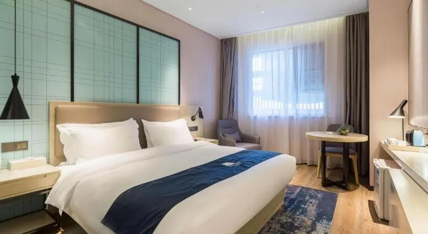 Bed in Echarm Hotel Nanjing Jiangning Tianyin Avenue Metro Station