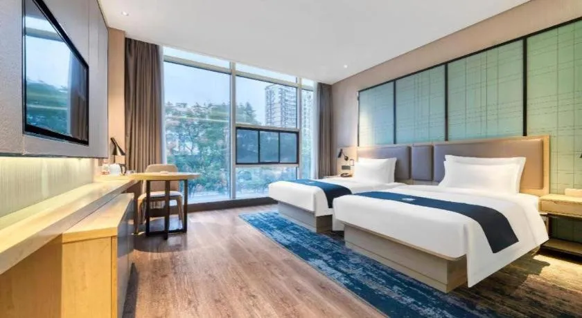 Bed in Echarm Hotel Nanjing Jiangning Tianyin Avenue Metro Station