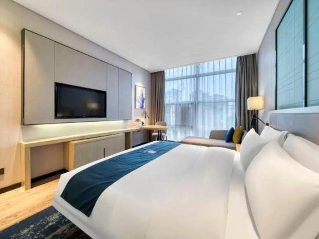 Bed in Echarm Hotel Nanjing Jiangning Tianyin Avenue Metro Station