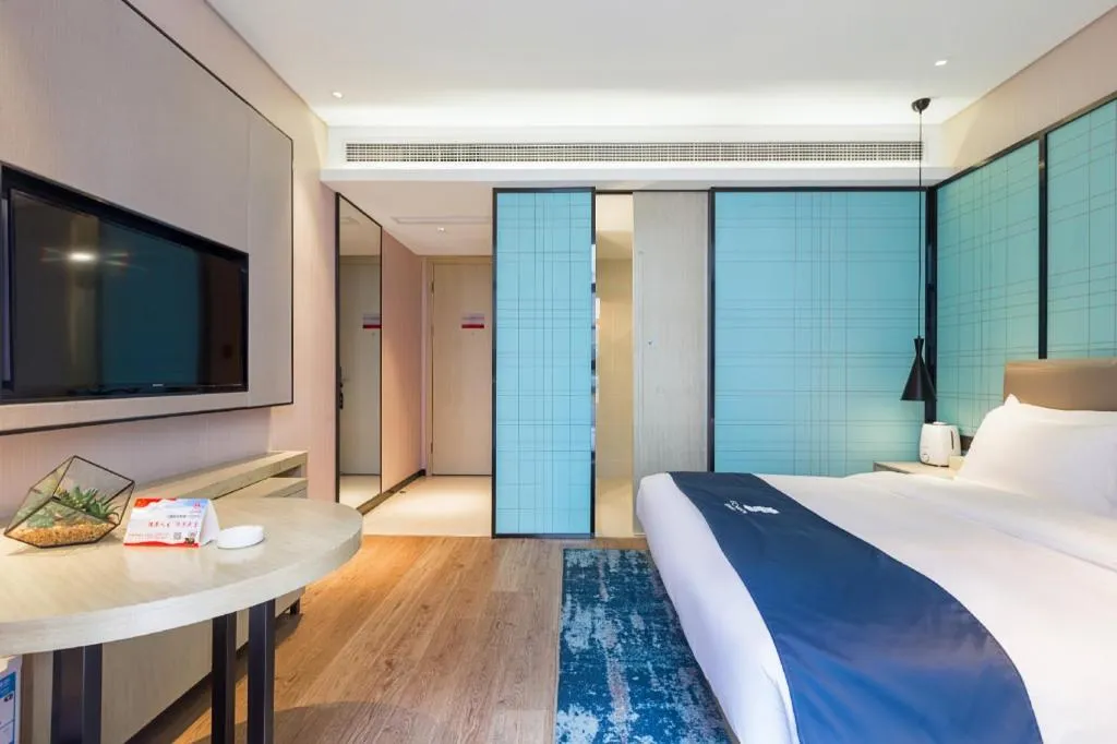 Bed in Echarm Hotel Nanjing Jiangning Tianyin Avenue Metro Station