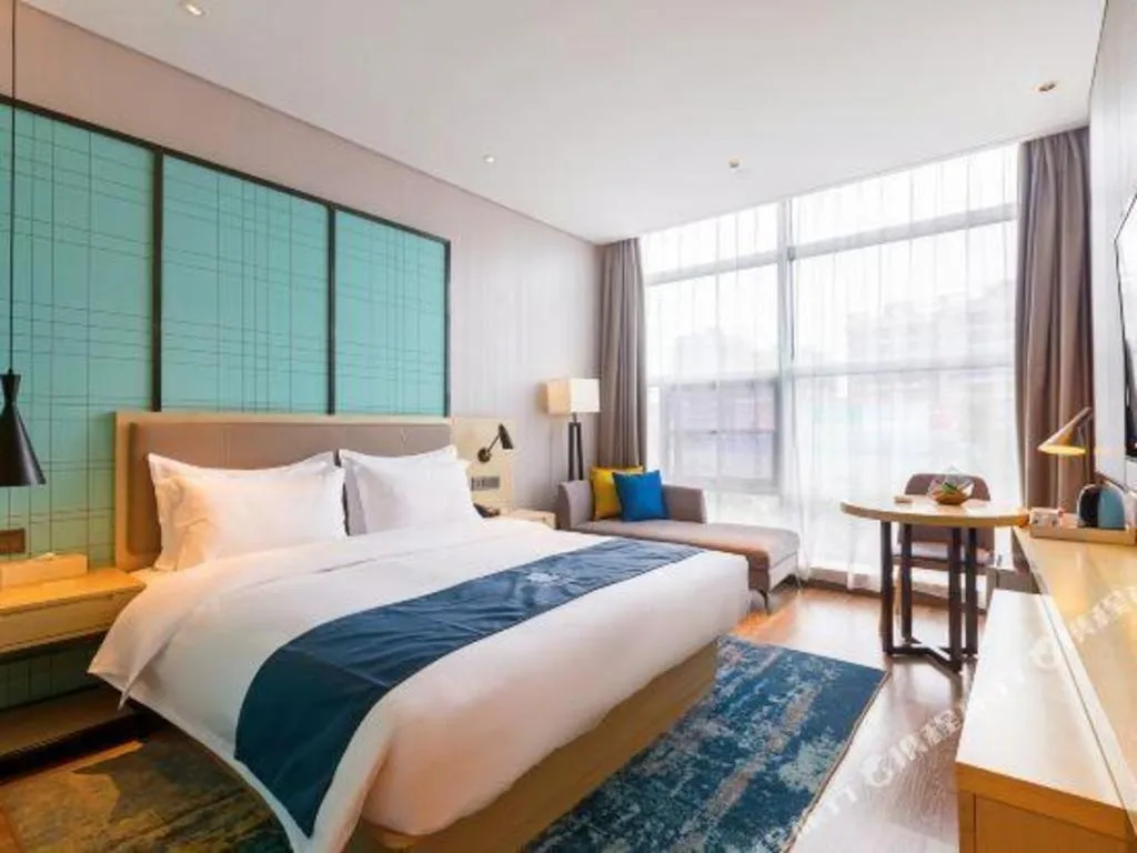 Bed in Echarm Hotel Nanjing Jiangning Tianyin Avenue Metro Station