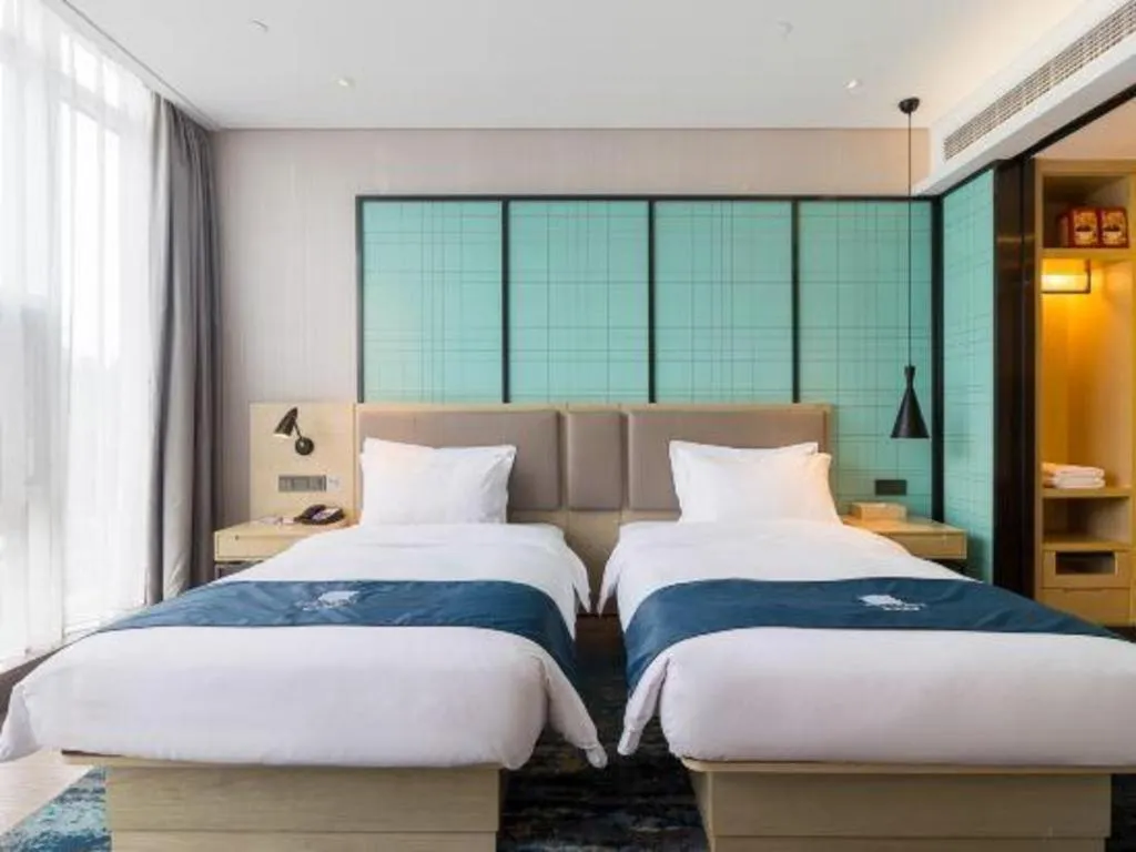 Bed in Echarm Hotel Nanjing Jiangning Tianyin Avenue Metro Station