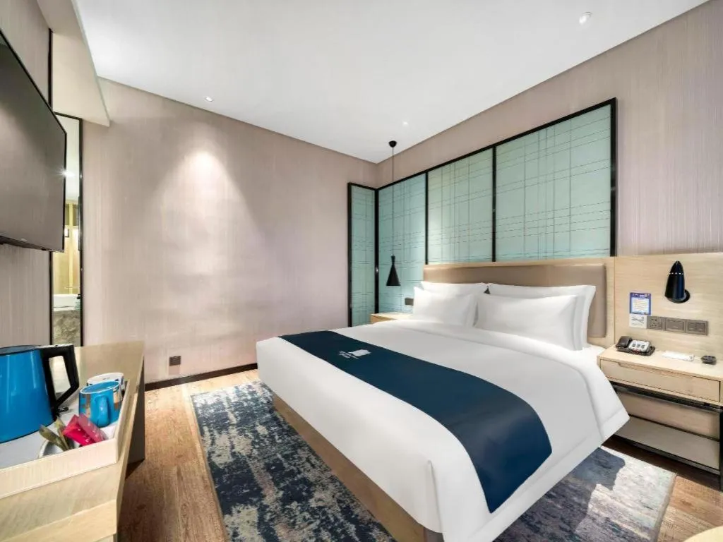 Bed in Echarm Hotel Nanjing Jiangning Tianyin Avenue Metro Station