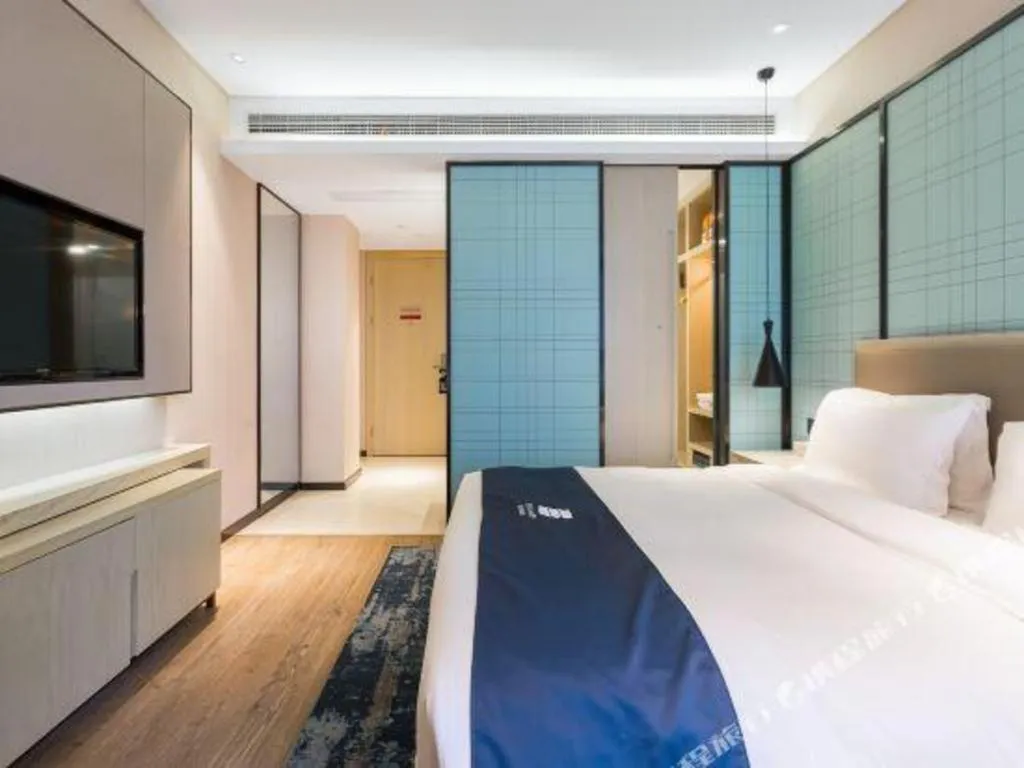 Bed in Echarm Hotel Nanjing Jiangning Tianyin Avenue Metro Station