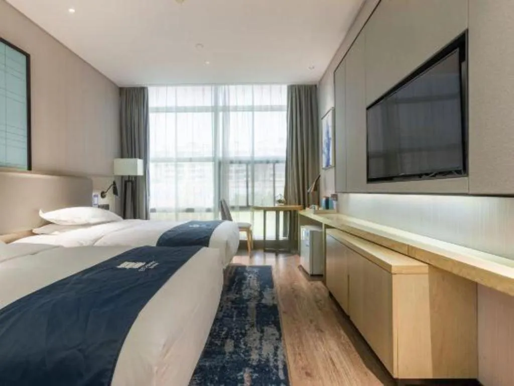 Bed in Echarm Hotel Nanjing Jiangning Tianyin Avenue Metro Station