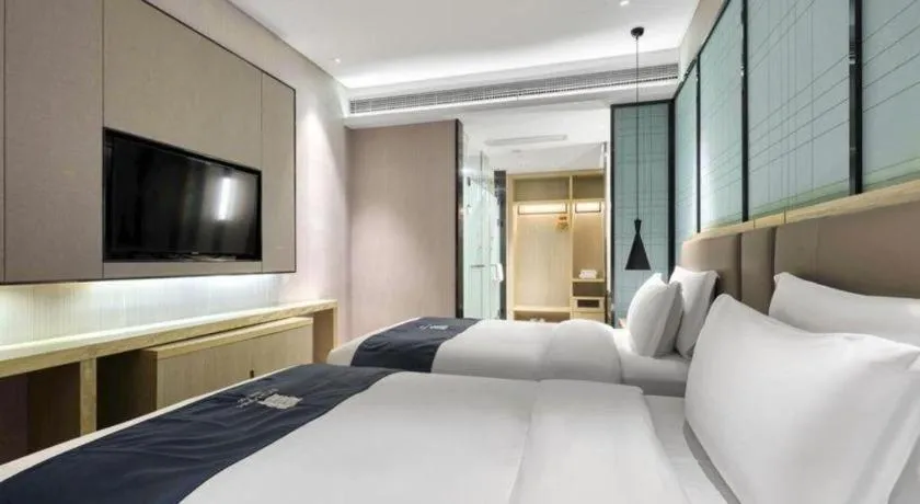 Bed in Echarm Hotel Nanjing Jiangning Tianyin Avenue Metro Station