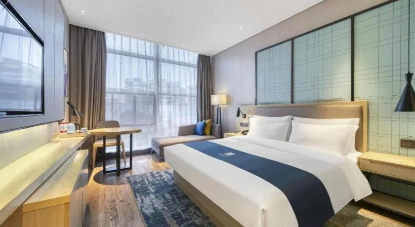 Bed in Echarm Hotel Nanjing Jiangning Tianyin Avenue Metro Station