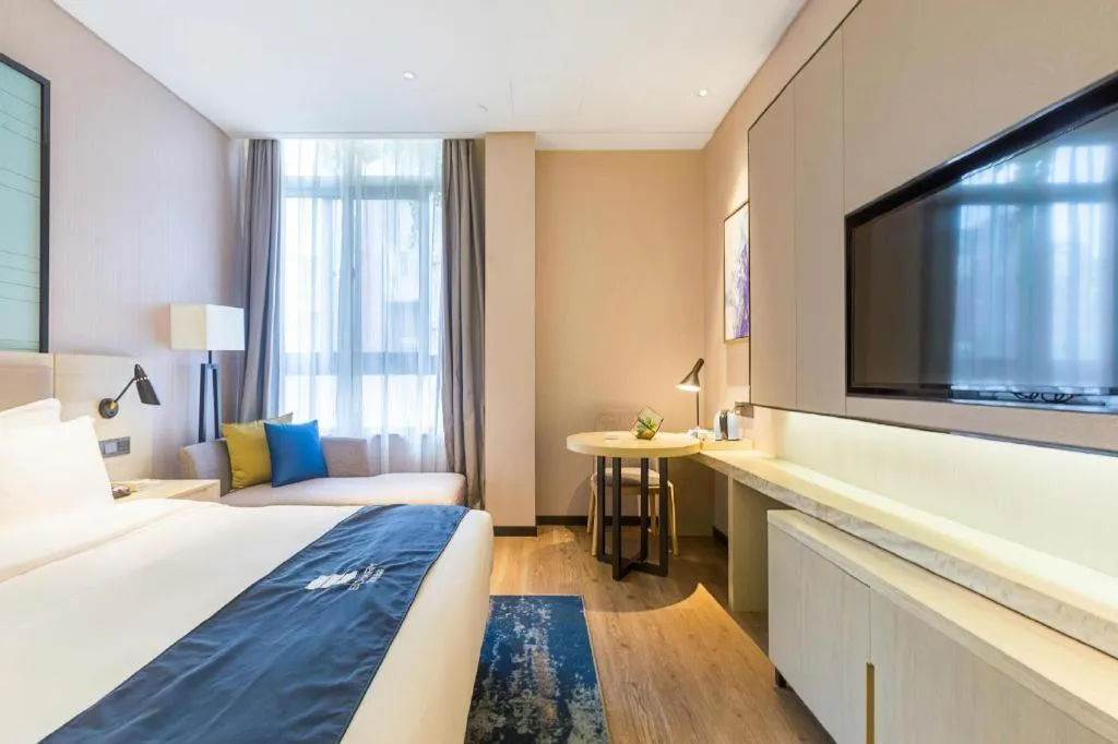 Bed in Echarm Hotel Nanjing Jiangning Tianyin Avenue Metro Station