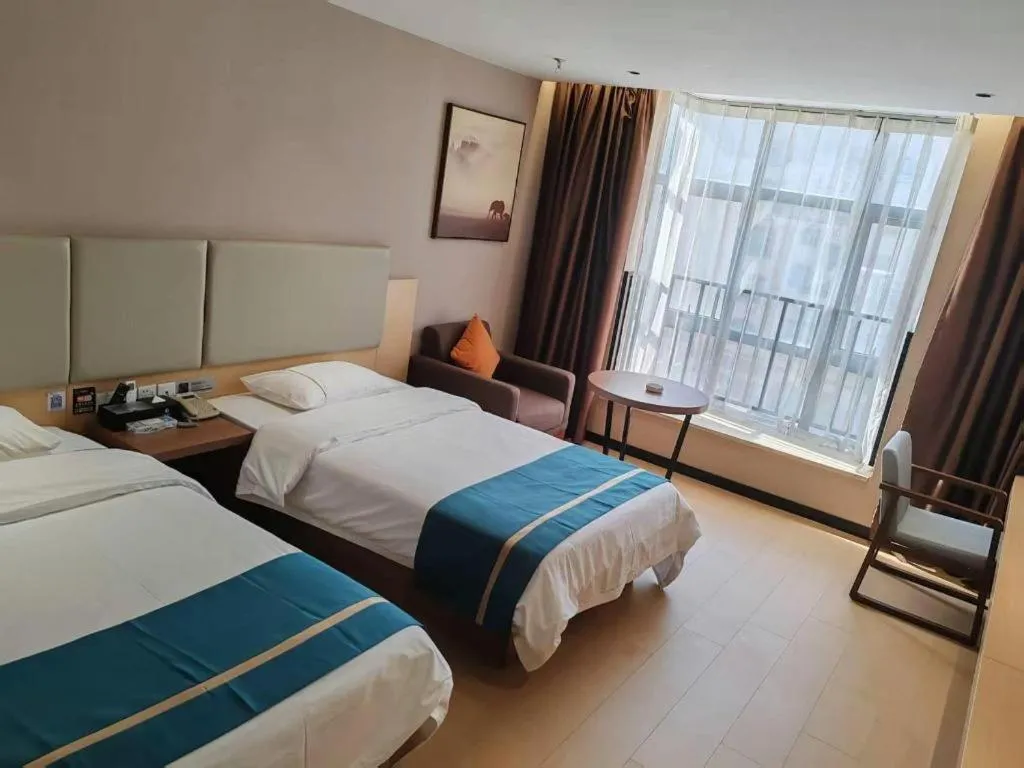 Bed in JTOUR Inn Maoming Gaozhou Guabangling Park