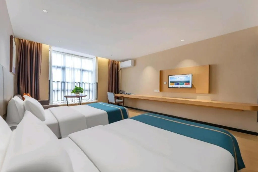 Bed in JTOUR Inn Maoming Gaozhou Guabangling Park