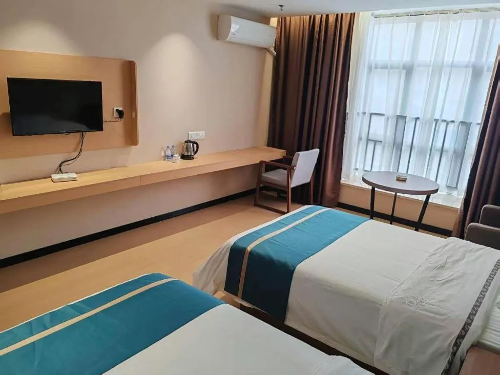 Bed in JTOUR Inn Maoming Gaozhou Guabangling Park