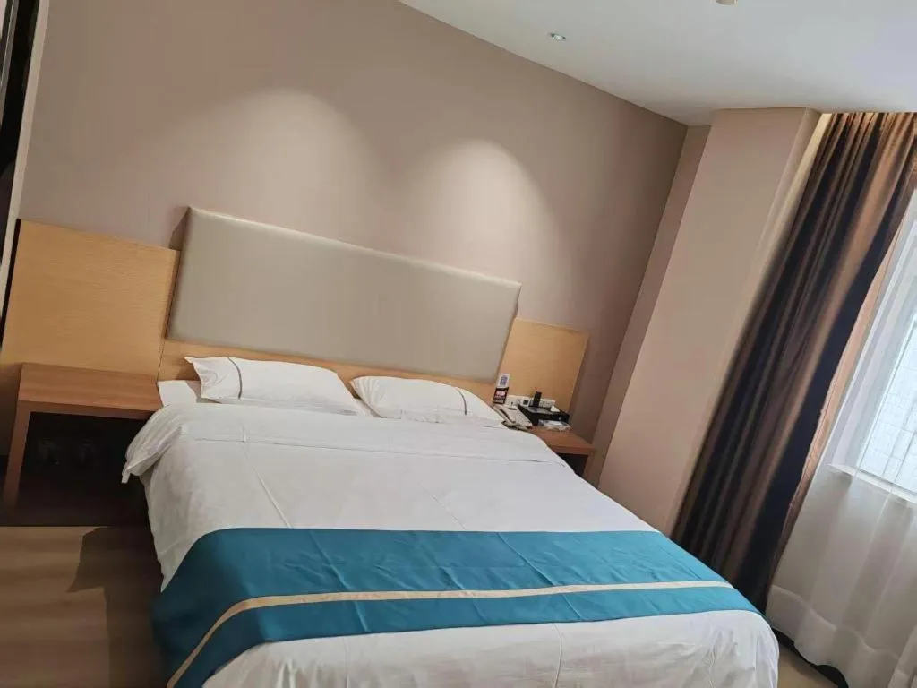 Bed in JTOUR Inn Maoming Gaozhou Guabangling Park