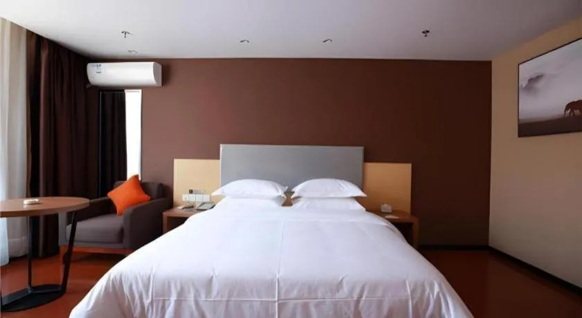 Bed in JTOUR Inn Maoming Gaozhou Guabangling Park