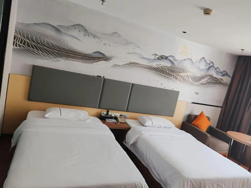 Bed in JTOUR Inn Maoming Gaozhou Guabangling Park