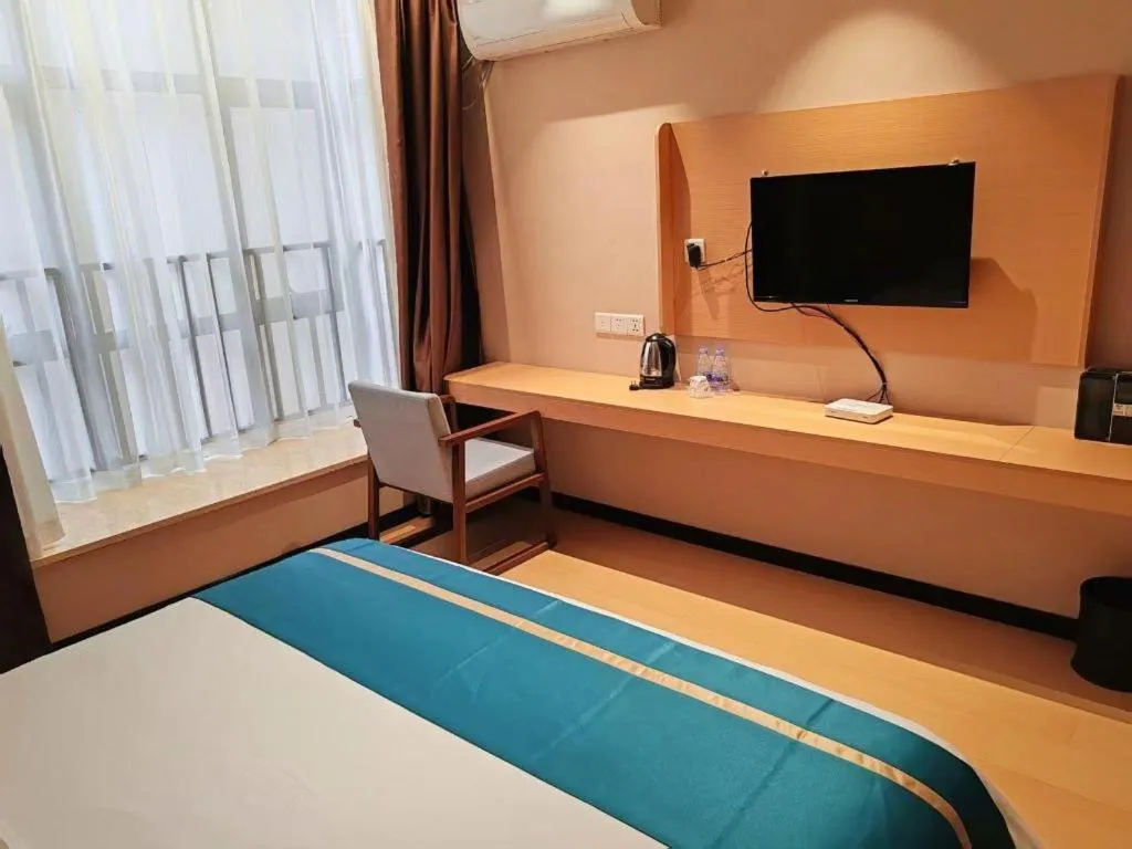 Bed in JTOUR Inn Maoming Gaozhou Guabangling Park