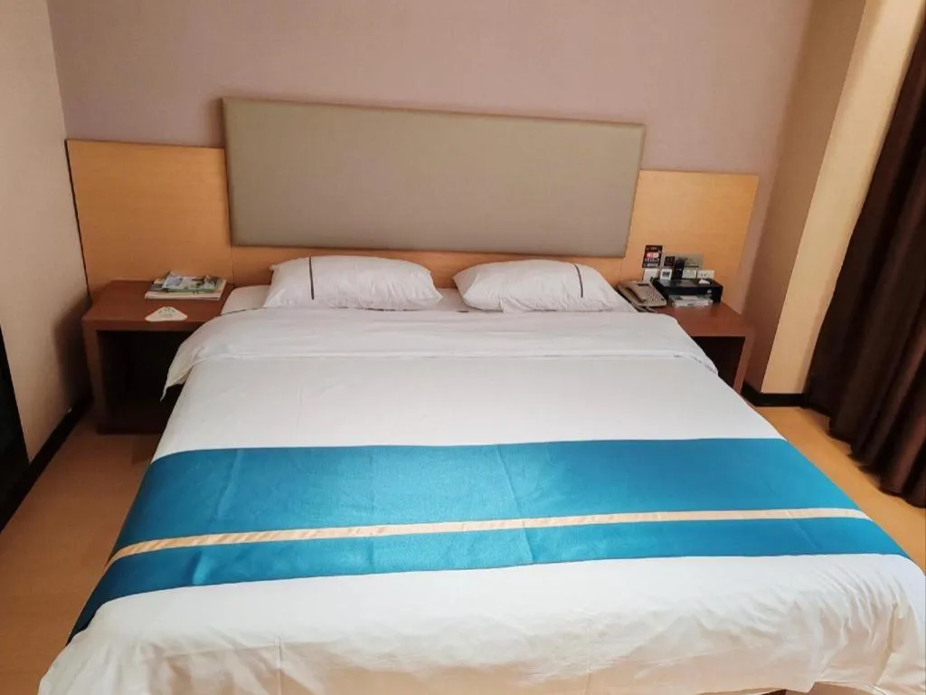 Bed in JTOUR Inn Maoming Gaozhou Guabangling Park