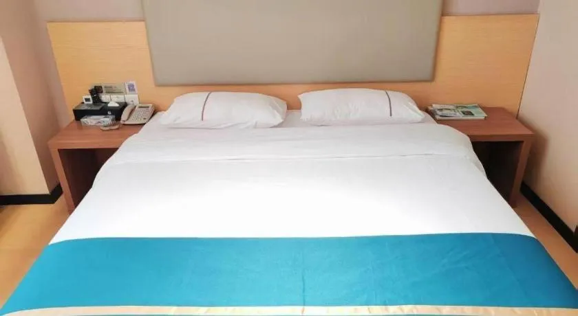 Bed in JTOUR Inn Maoming Gaozhou Guabangling Park