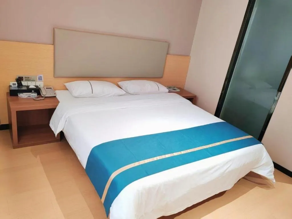 Bed in JTOUR Inn Maoming Gaozhou Guabangling Park
