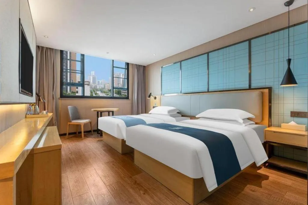 Bed in Echarm Hotel Wuhan Vanke Future Center Wulidun Metro Station