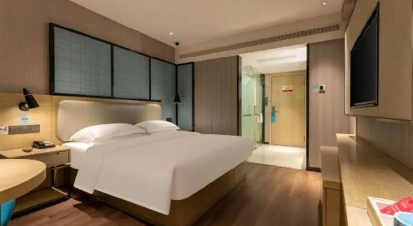 Bed in Echarm Hotel Wuhan Vanke Future Center Wulidun Metro Station